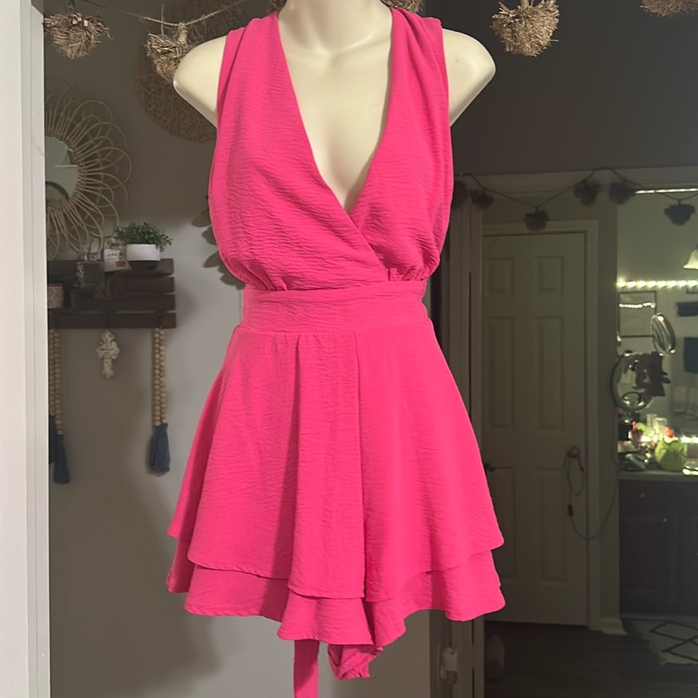 Never worn with tags pink romper!